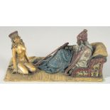 A VIENNA PAINTED COLD CAST BRONZE GROUP, Arab and nude. 7ins long.