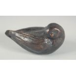 A SMALL BRONZE OF A BIRD Signed, 4ins long.