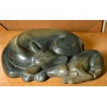 Ronnie Dongo (b.1967) A carved stone sculpture of a cow and calf, signed, 7" high x 21" long by