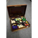 A good French kingwood and brass inlaid box containing numerous gaming chips.