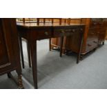 A mahogany breakfront three drawer side table.