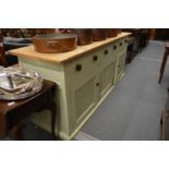 A good large pine and painted pine dresser base with three frieze drawers and pair of cupboard