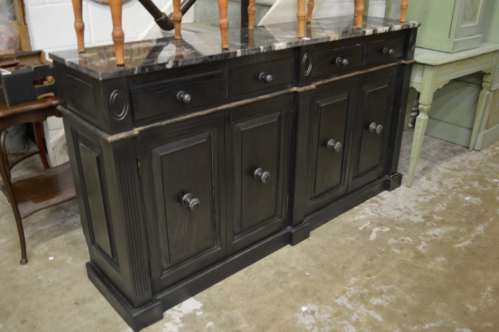 A marble top painted sideboard.