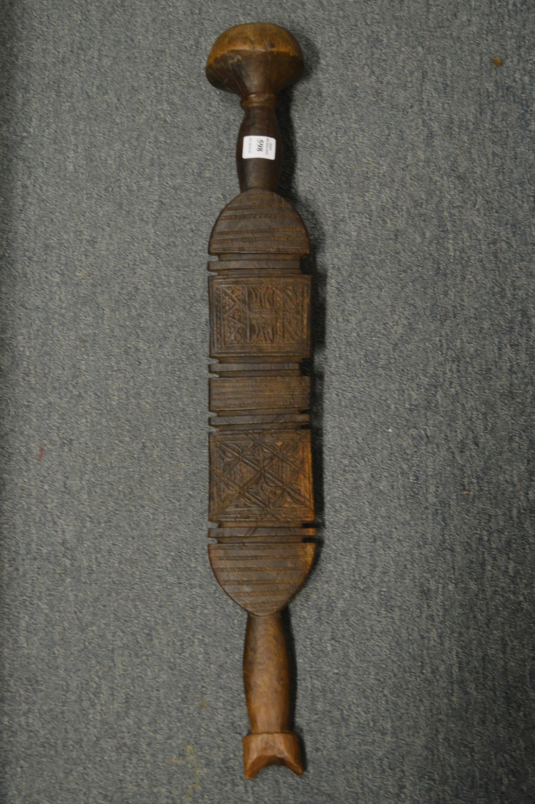 African carved wood paddle or club.