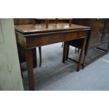 A George III mahogany rectangular fold-over tea table.