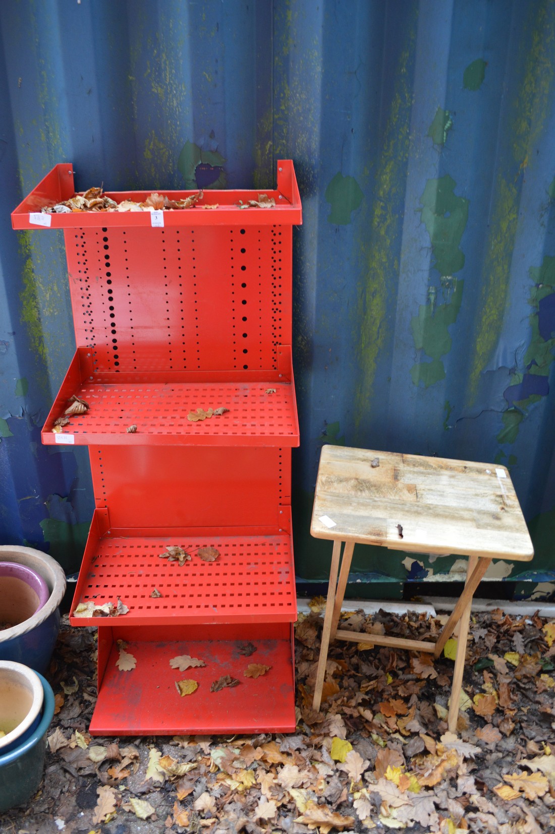 Workshop shelving and a small table.