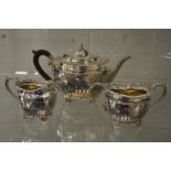 A hallmarked silver teapot with later sterling silver matching sugar bowl and milk jug.