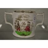 A Staffordshire twin handled loving cup 'Awkward Squad'.