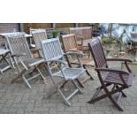 Two pairs of hardwood folding garden armchairs and a similar chair.