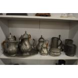 A quantity of Continental pewter jugs, coffee pots, tankards etc.