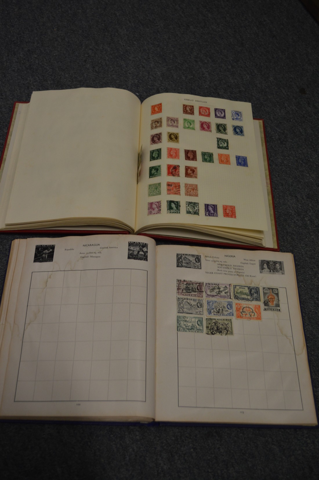 Two albums containing world stamps.