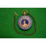 An ornate pocket watch with enamel and pearl decoration.