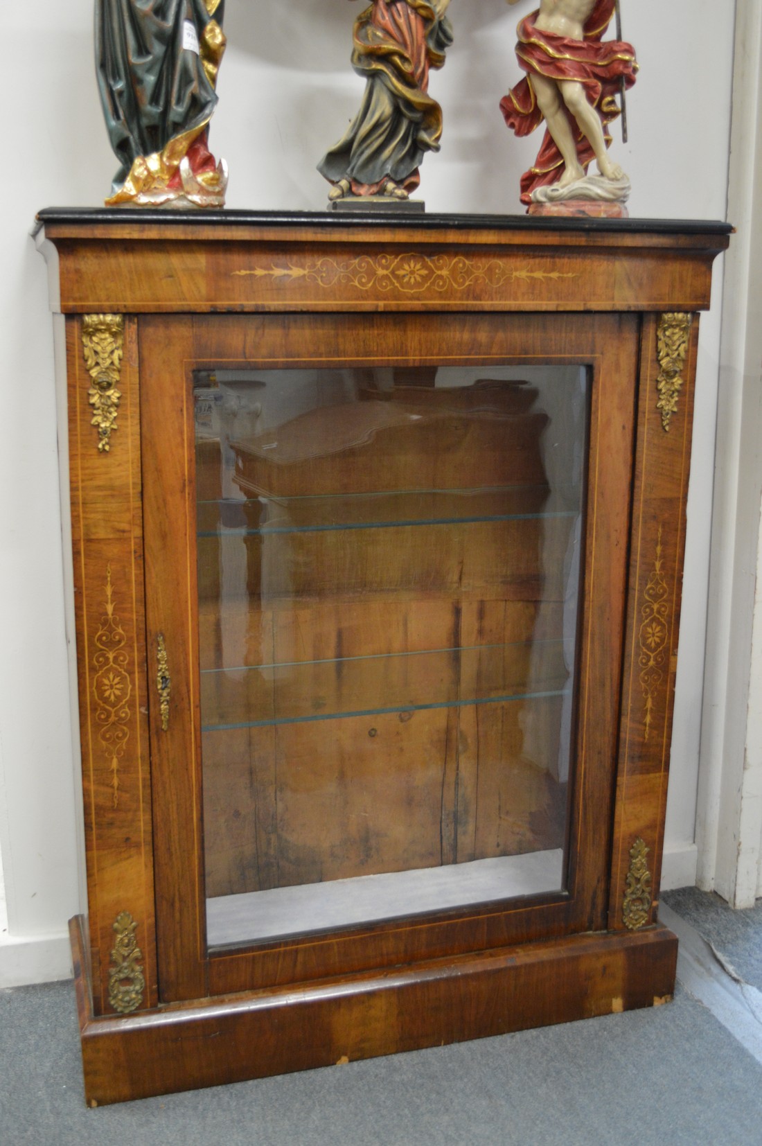 A Victorian inlaid walnut pier cabinet.