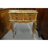 A French style gilt decorated two drawer side table.