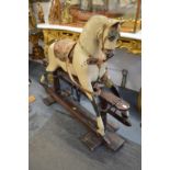 A good early large cream painted rocking horse.