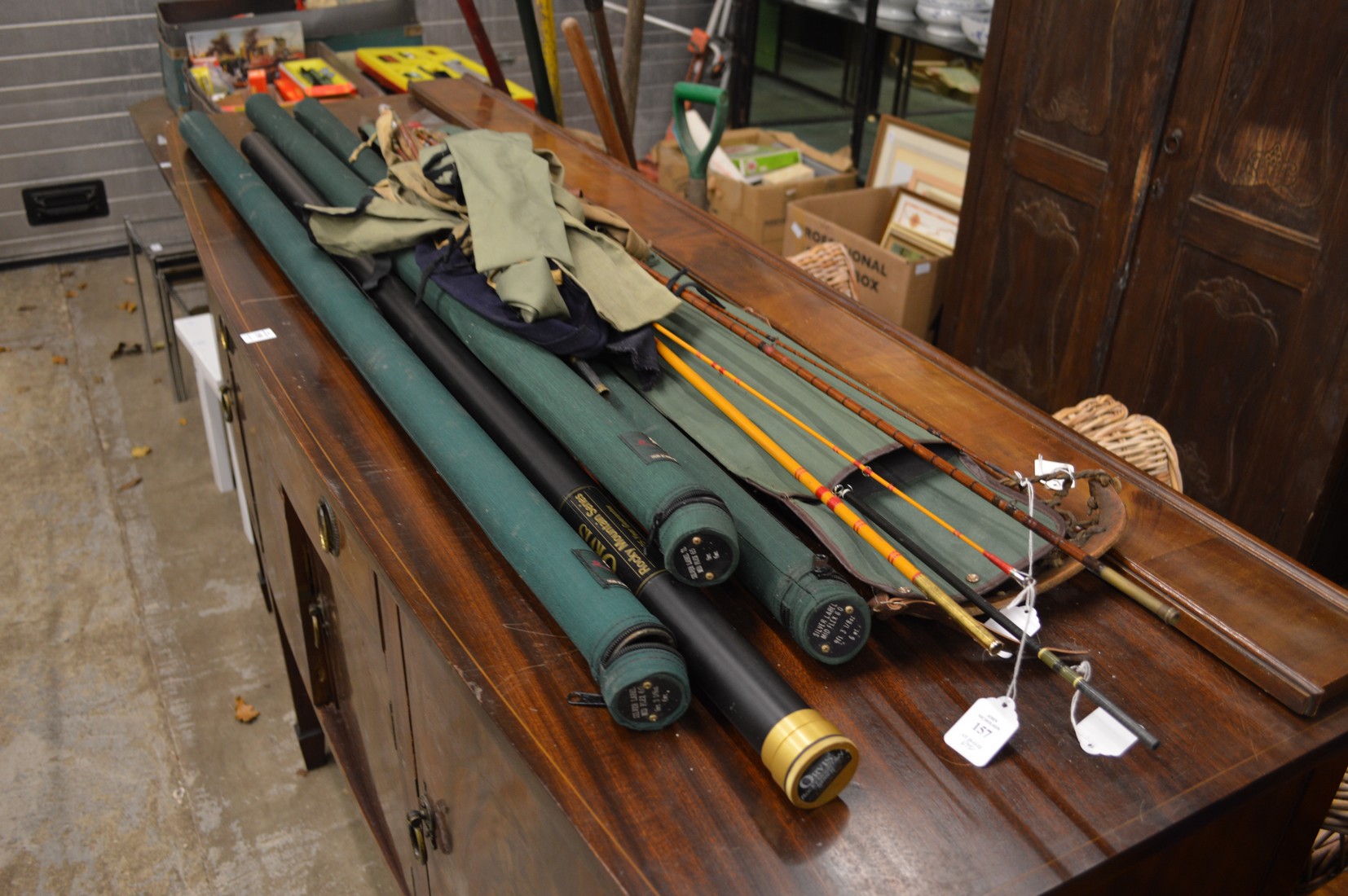 Split cane fly rods and a quantity of Orvis rod tubes.