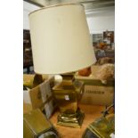 A large brass table lamp.