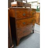 A 19th century mahogany bow front chest of two short and two long drawers on bracket feet.