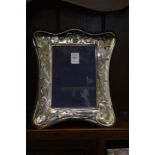 A large silver photograph frame.