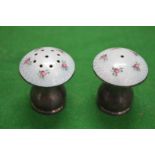 A pair of silver and enamel decorated mushroom shape salt and peppers.