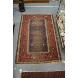 A small Belouch rug (worn) 150cm x 100cm.