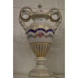 A Continental porcelain twin handle vase and cover painted with swags of flowers.
