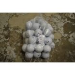 A bag of fifty Srixon golf balls.