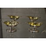 A good set of four silver and silver gilt pedestal salts.