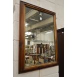 A modern rectangular wall mirror.