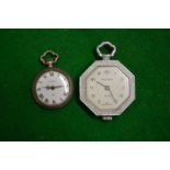 A miniature silver fob watch and another.
