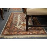 An Indian rug, cream ground with floral decoration 145cm x 95cm.