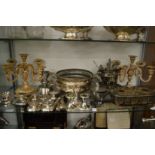 A quantity of plated ware to include a pair of candelabra.