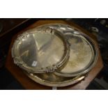 Three large circular plated trays.