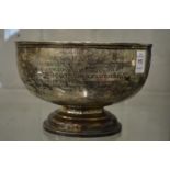 A silver pedestal bowl with presentation inscription.