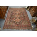 A Persian Qashqai rug with stylised decoration. 180cm x 135cm