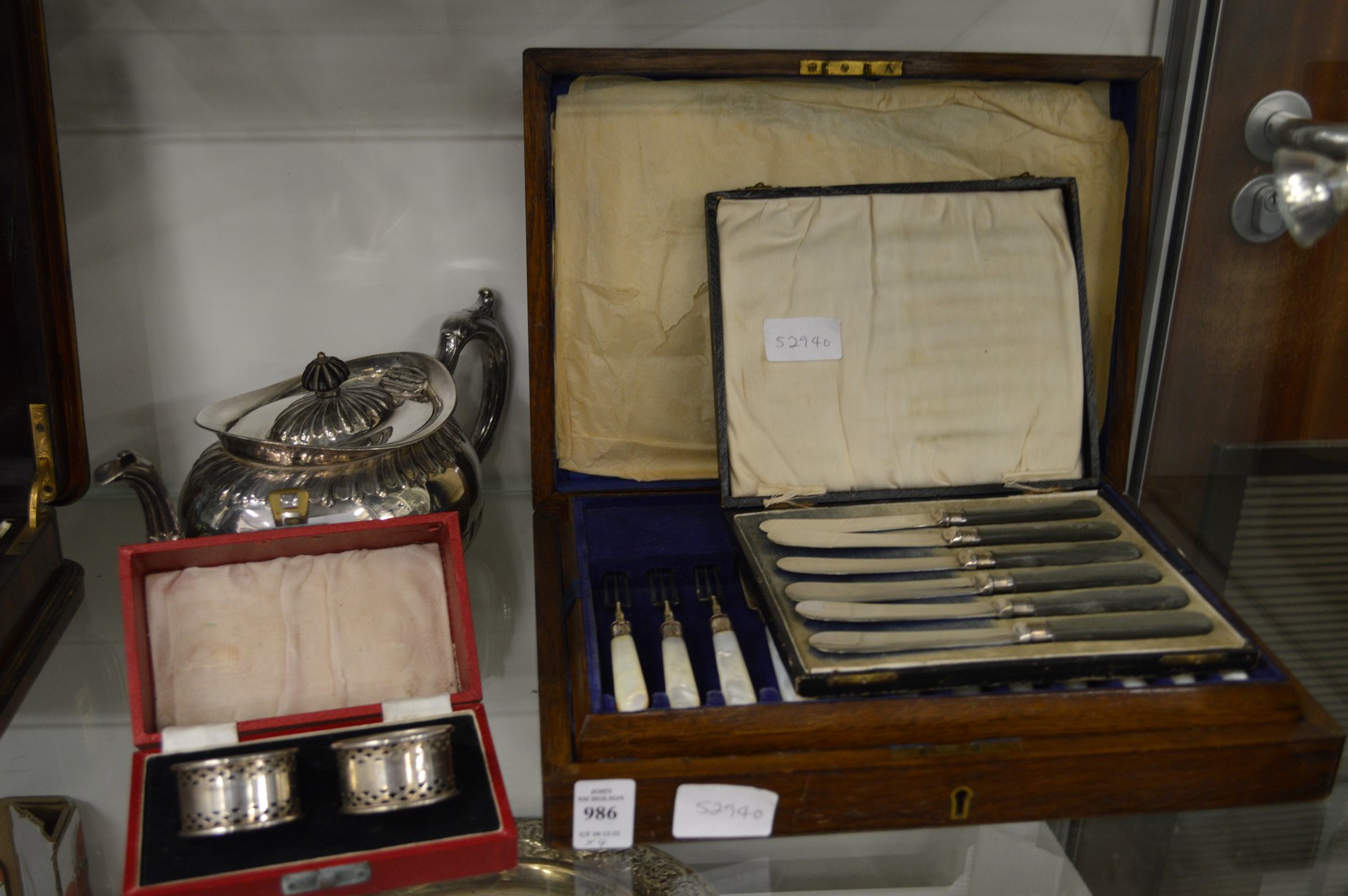 A cased set of twelve mother-of-pearl handled fruit knives and forks and other items.
