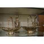 A pair of large plated vases and two plated cake baskets.
