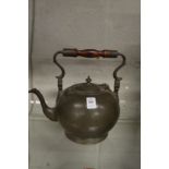 A pewter teapot.