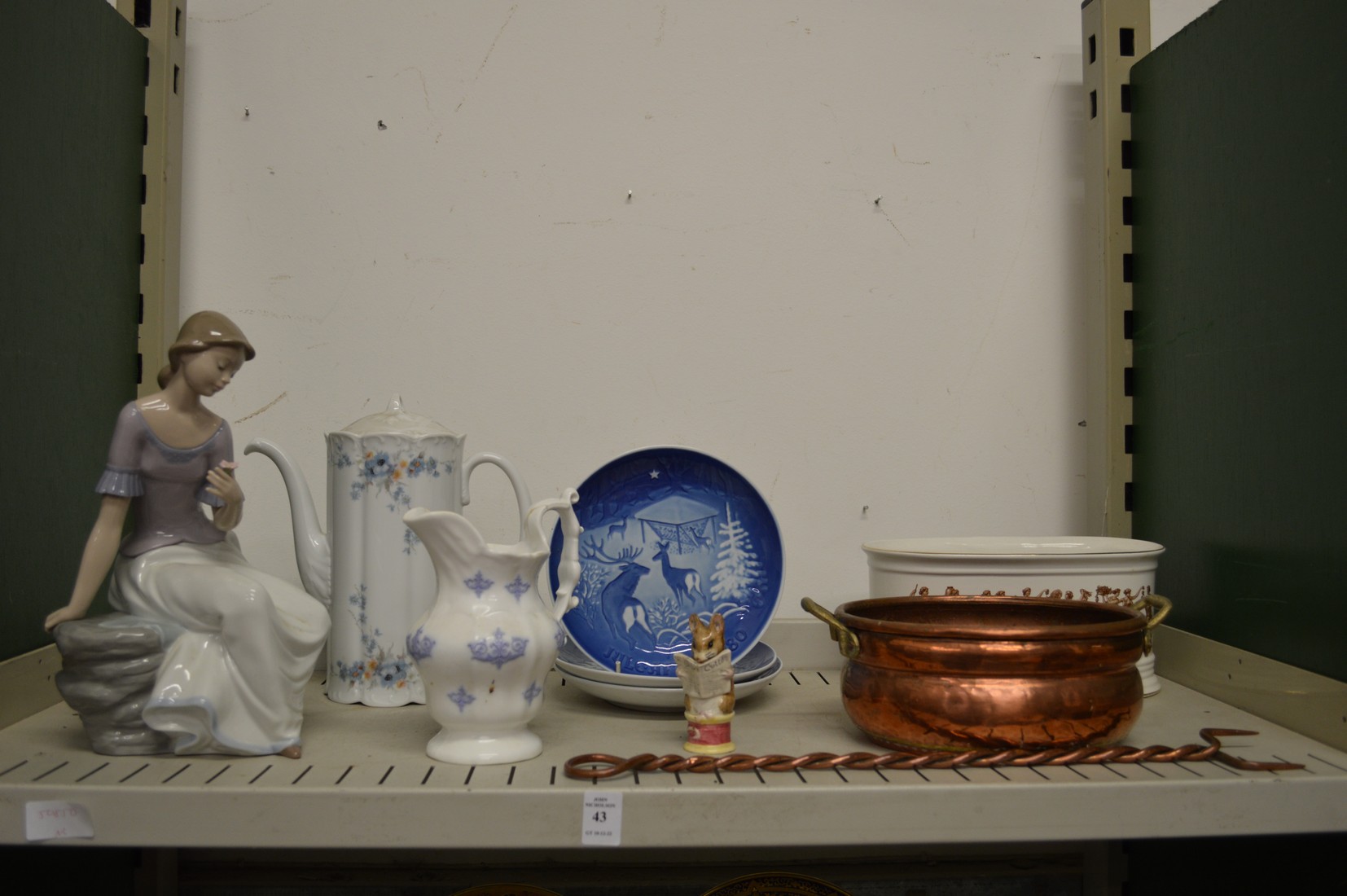 A Nao figurine and other decorative items.