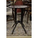 A burr wood circular occasional table on slender supports with ormolu mounts.