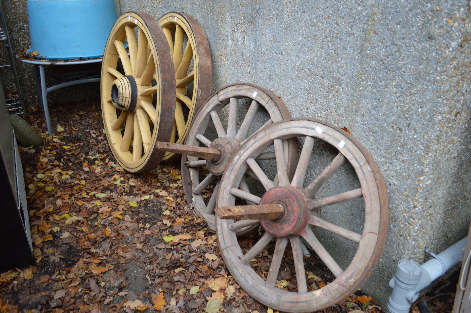 Two pairs of wagon wheels.