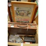 A small suitcase, bookrack and other items.