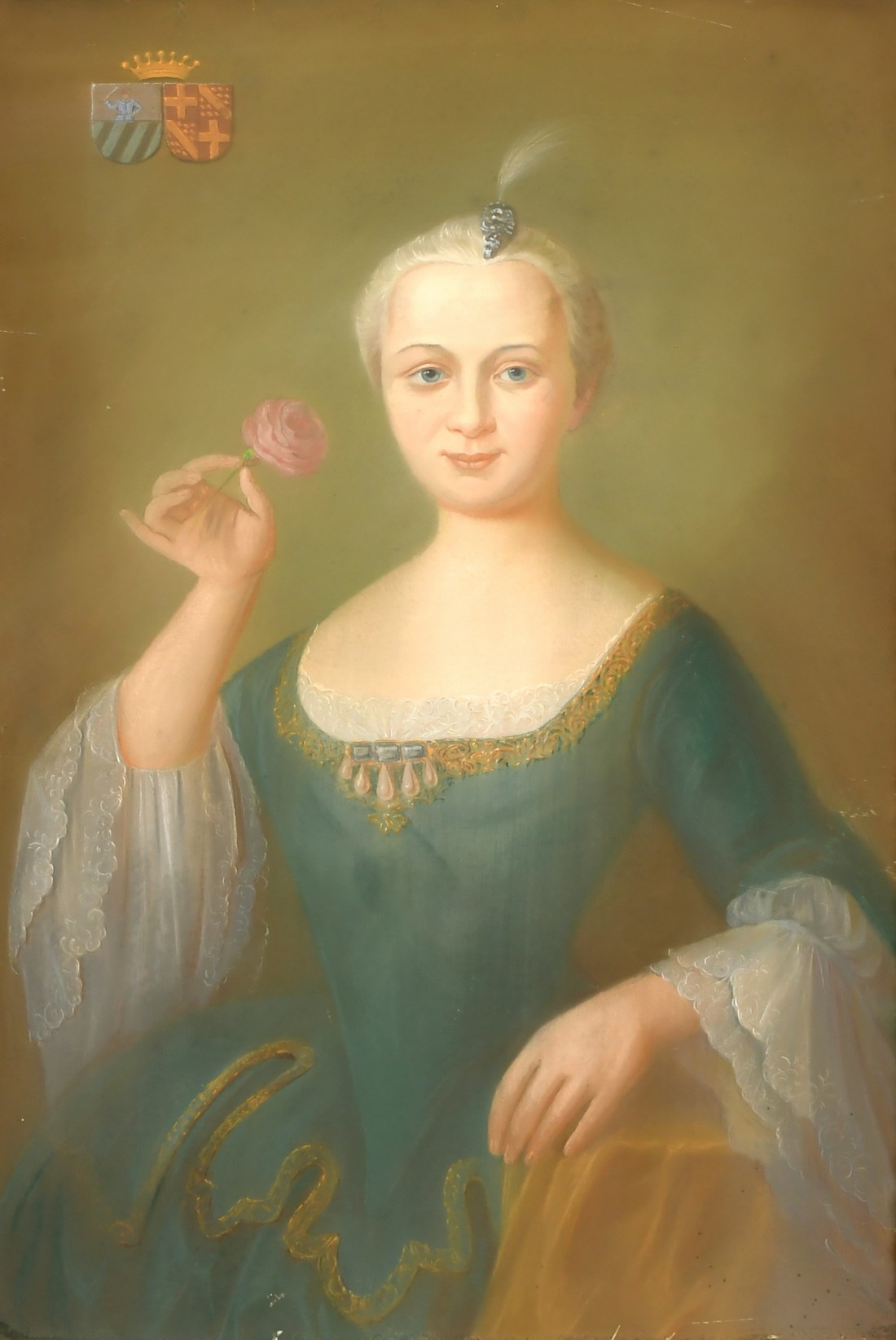 A 19th Century Continental School pastel portrait of lady holding a flower with a coat of arms top