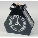 A REPLICA BLACK MERCEDES BENZ OIL CAN.