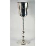 A BOLLINGER CHAMPAGNE COOLER on a circular stand 34ins high.