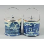 A PAIR OF WILLOW PATTERN BISCUIT BARRELS