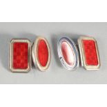 A PAIR OF SILVER AND RED ENAMEL CUFF LINKS.