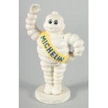 A SMALL PAINTED CAST IRON MICHELIN MAN. 6.5ins high.