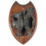 A 19TH CENTURY BLACK FOREST CARVED WOOD PLAQUE, two game birds.