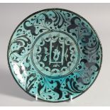 A 17TH/18TH CENTURY OTTOMAN DAMASCUS GLAZED POTTERY DISH, 22cm diameter.